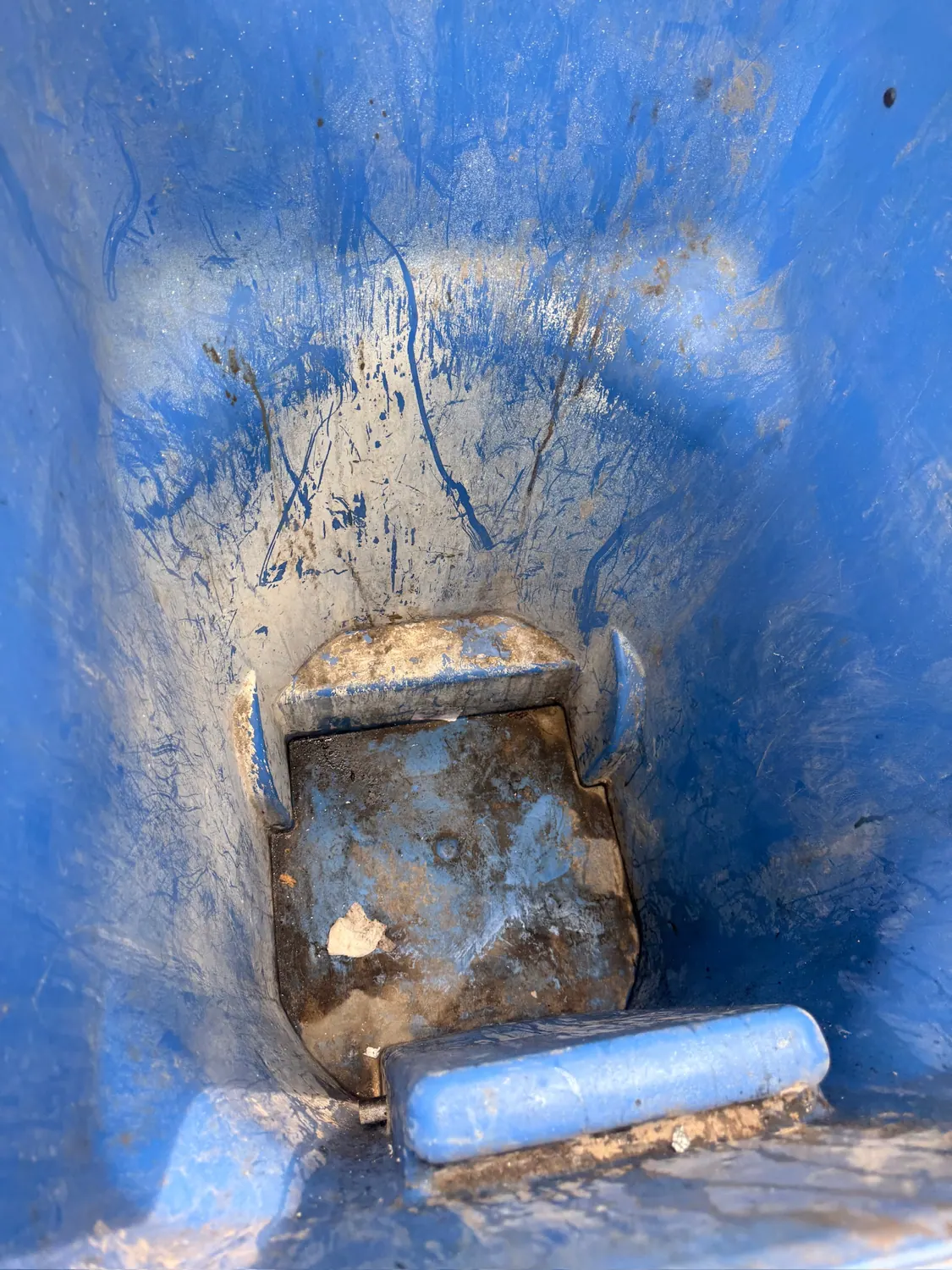 Dirty trash bin before cleaning